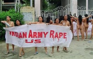 Naked women protestors shout slogans against the alleged rape, torture and murder of Thangjam Manorama by paramilitary soldiers in Imphal, capital of northeastern Indian state of Manipur, Thursday, July 15, 2004.